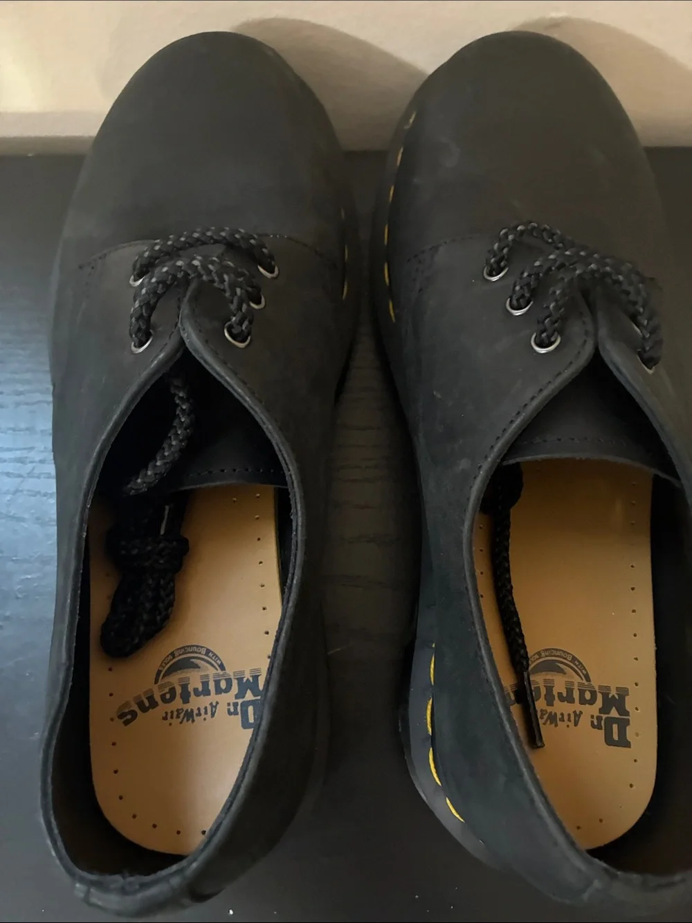 Dr. Martens 1461 leather oxfords feature the brand's signature yellow size 8